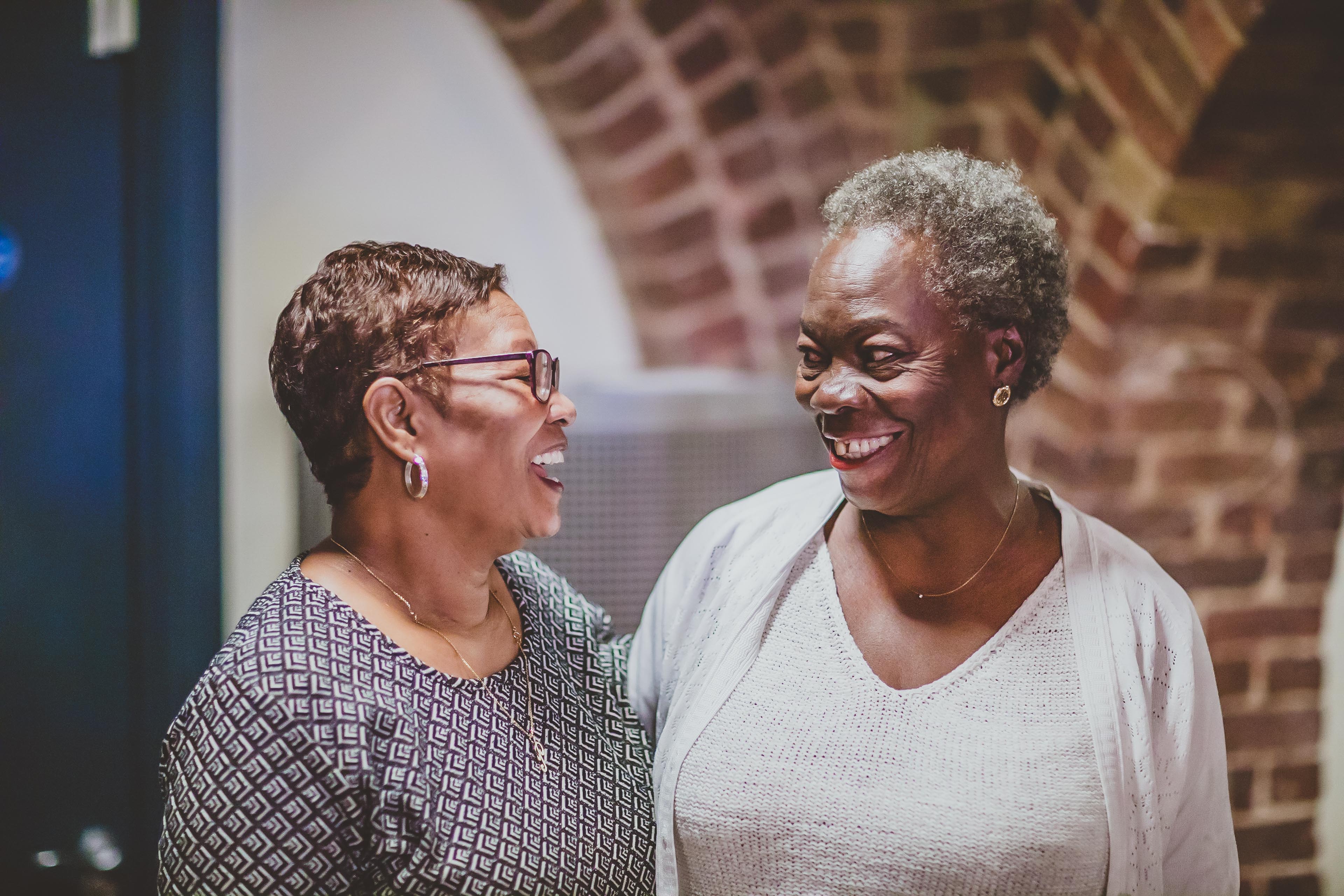 Two ladies smiling as they talk about their Diabetes UK membership and recent Balance magazine delivery