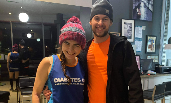 Megan and brother stood smiling at camera