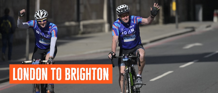 Two cyclists on bicycles in Diabetes UK jerseys