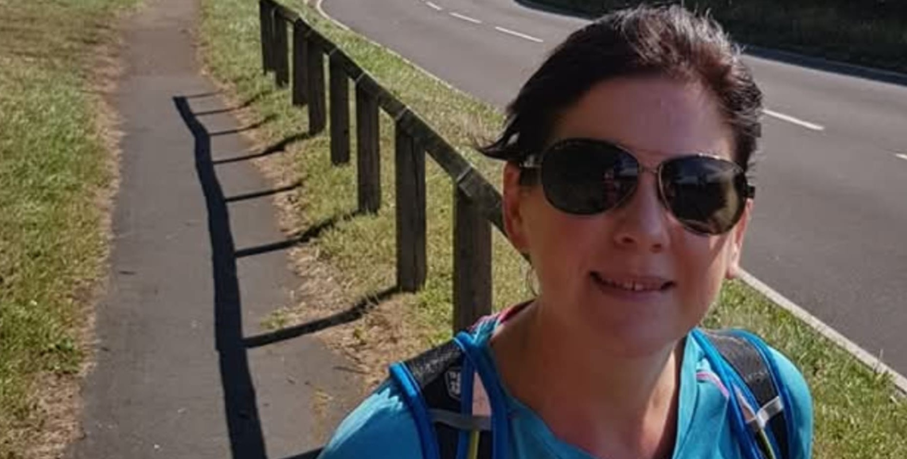 Volunteer Vicky Greenbank, pictured wearing sunglasses and a blue t shirt 