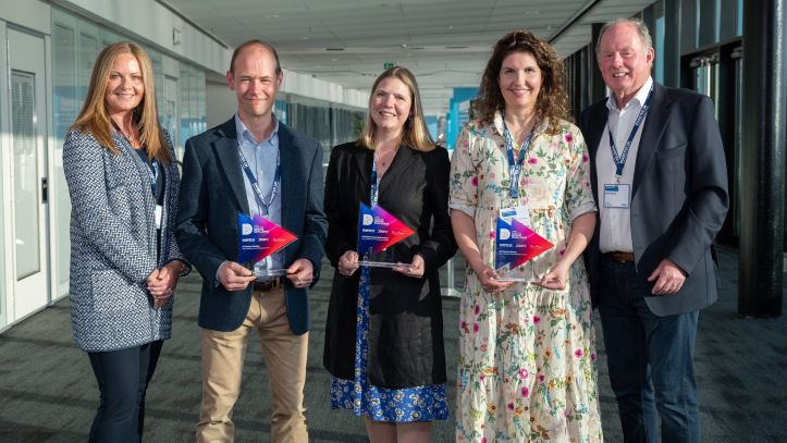 Steve and Sally Morgan standing with researchers from the Type 1 Diabetes Grand Challenge. 