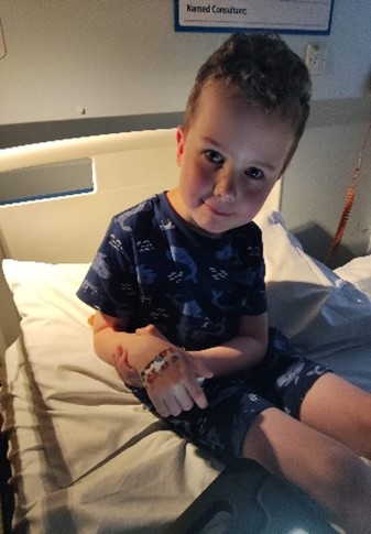 Jack sitting on a hospital bed