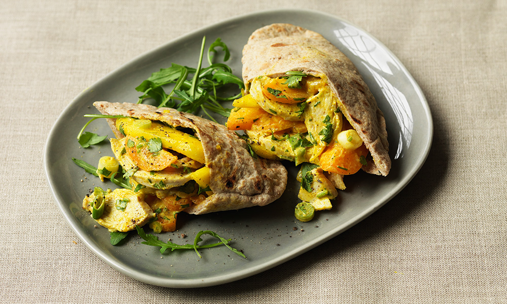 Fruity coronation chicken pitta