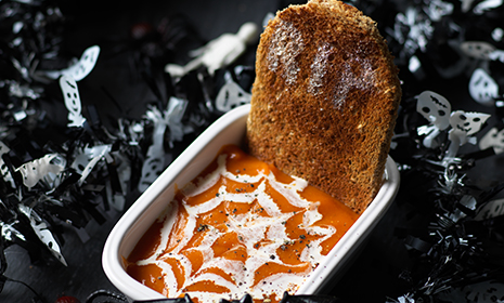 Scary pumpkin soup with tombstone bread