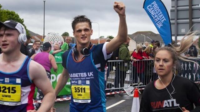 Man running along race route 