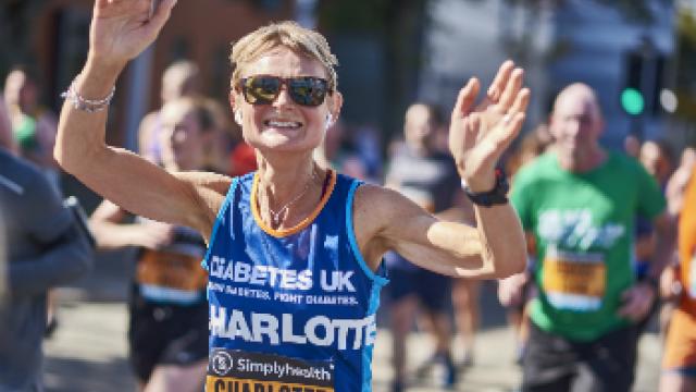Lady running with arms in air 