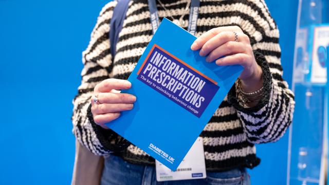 lady holding a leaflet
