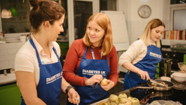 Ladies at event wearing aprons