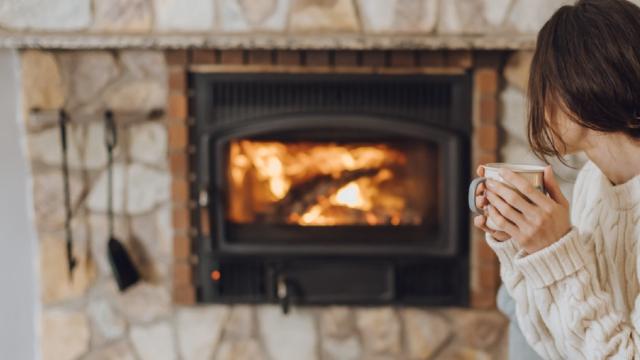 woman sitting by fire