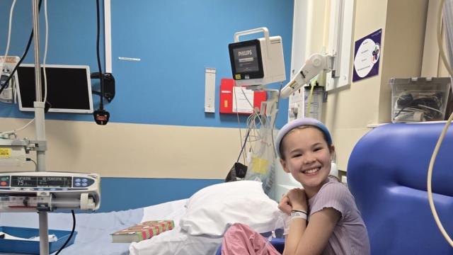 Imogen smiling in a hospital