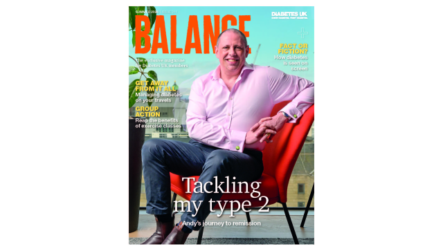 The cover of the summer issue of Balance magazine. A man in a light pink shirt and smart trousers sits in an orange chair and smiles at the camera. There's a big window behind him where you can see the city's buildings. 