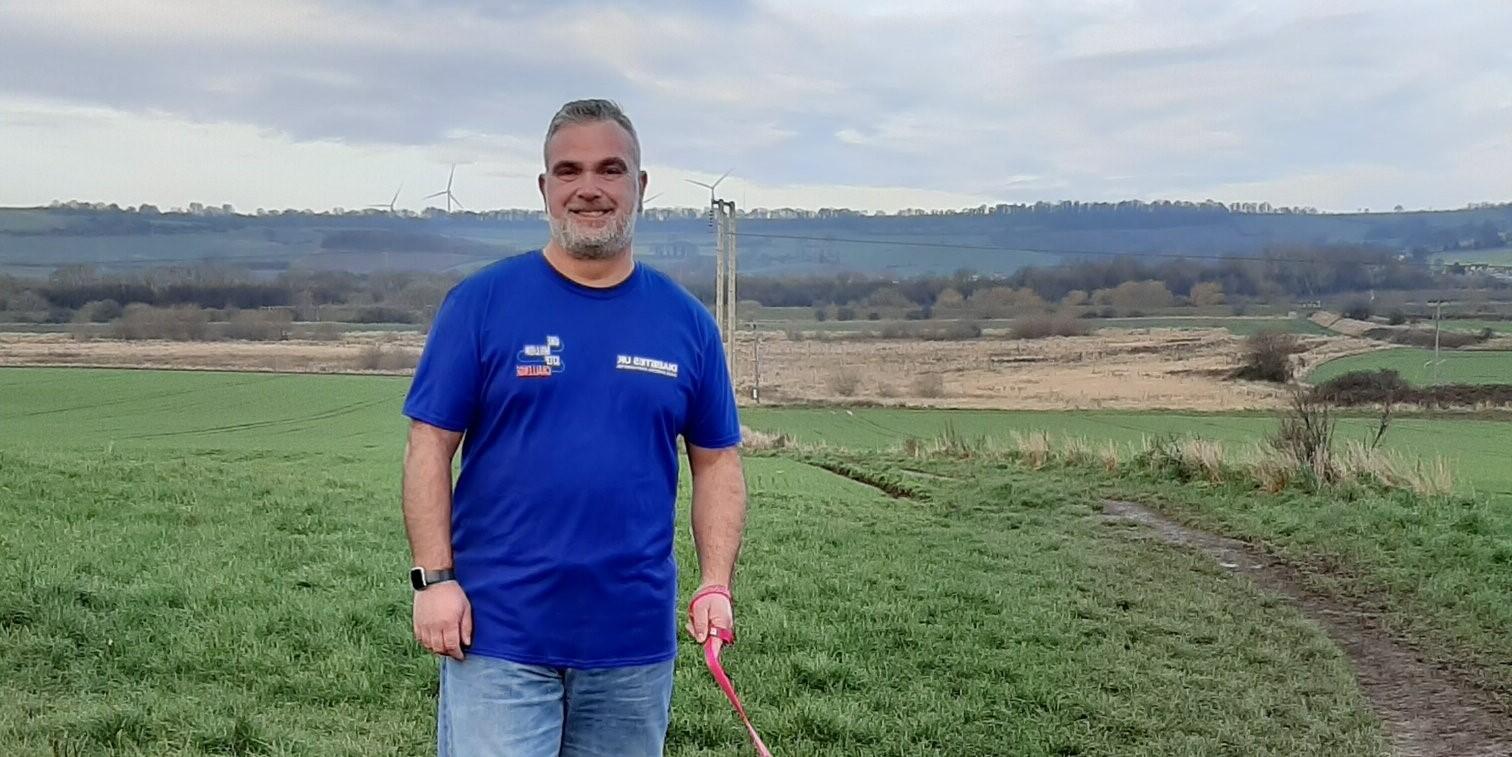 Steve smiling in his One Million Steps T-shirt