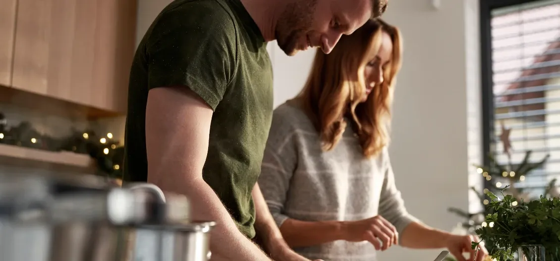 man and woman cooking