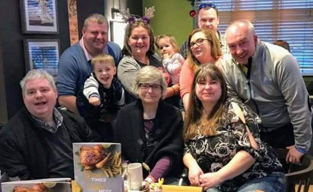 Sarah celebrating with her mum and family