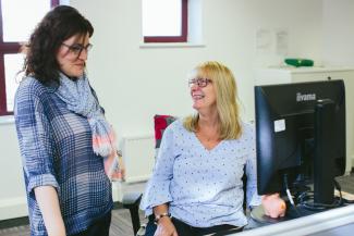 Two colleagues in the Diabetes Scotland office chatting