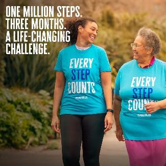 Two ladies walking and smiling with t shirts that say 'every step counts'