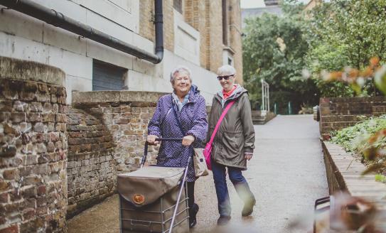 Two older ladies walking together