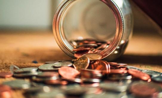 coins spilling out of a jar