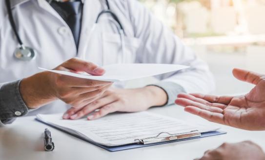 Doctor writing prescription