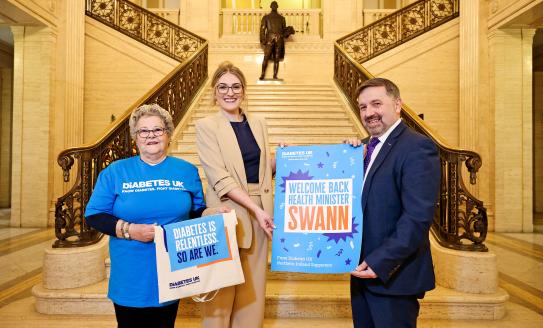 NI National Director Roxanne Small pictured at the Great Hall in Stormont with Health Minister Robin Swan and local volunteer Jean Bradshaw