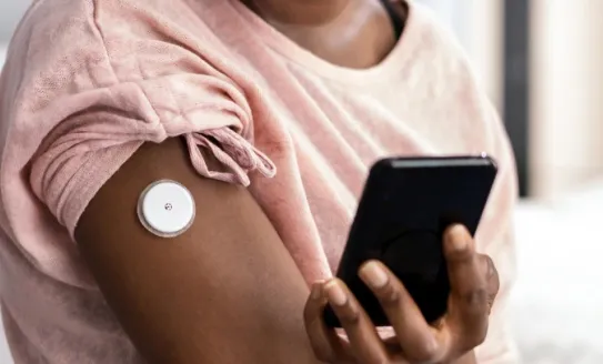 Woman checking CGM