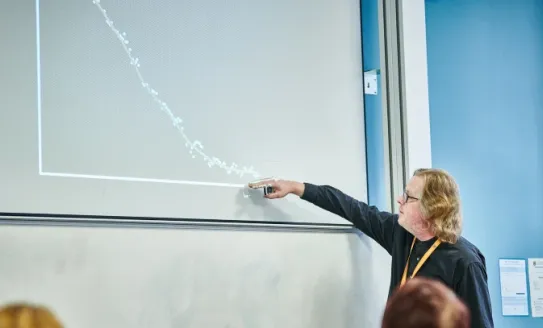 Person looking at data on a graph 
