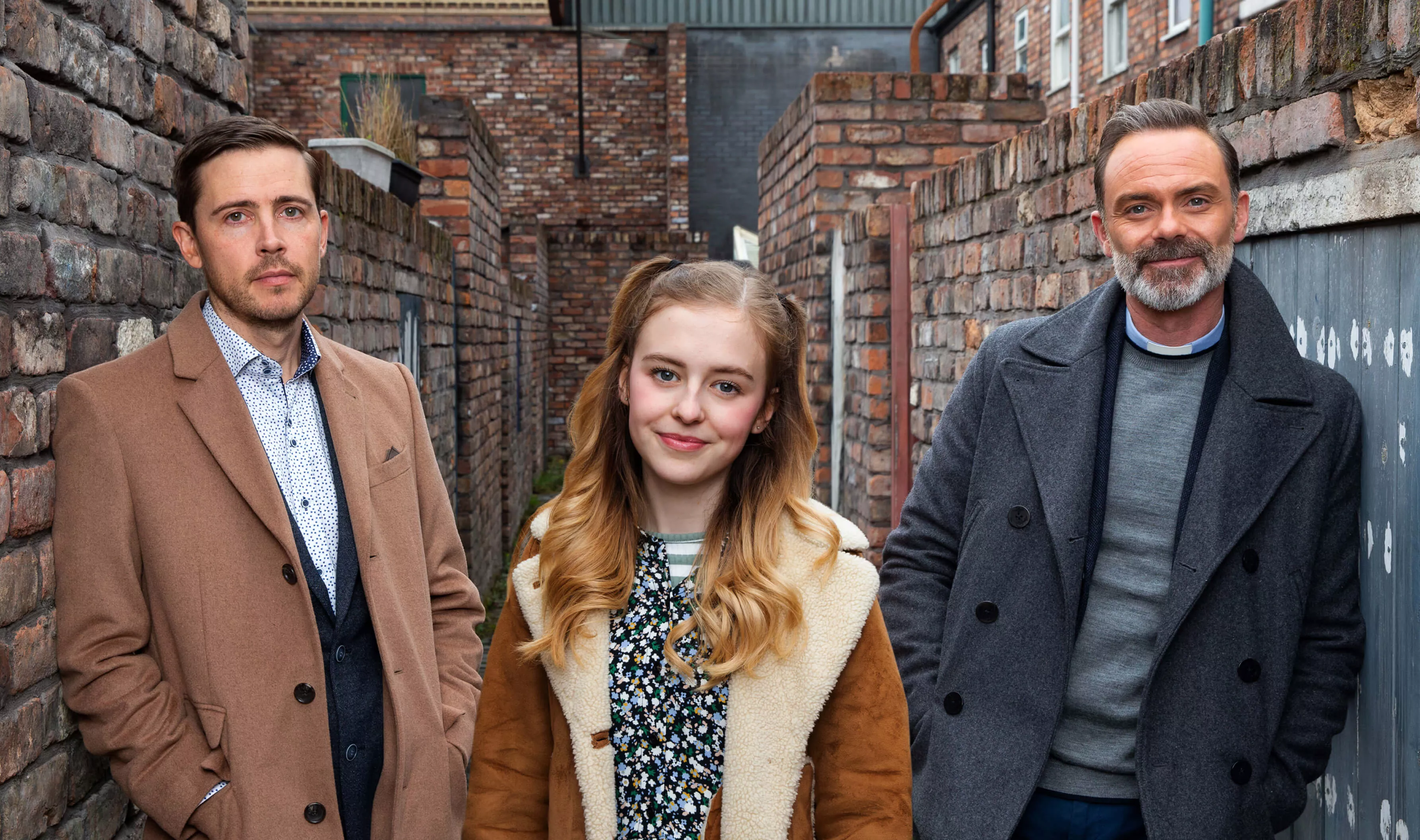 Todd, Summer and Billy from Coronation Street stand on set