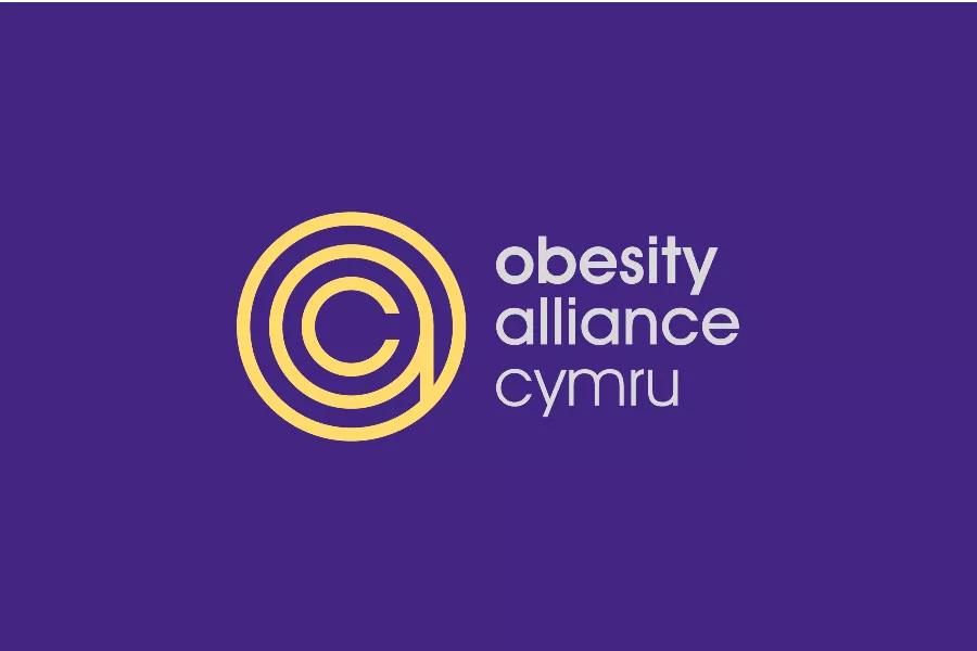 The image shows a purple background with a yellow logo with white text that reads 'obesity alliance Cymru'