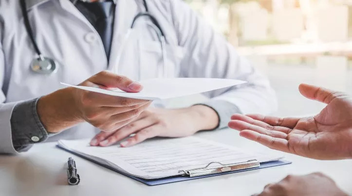 Doctor writing prescription