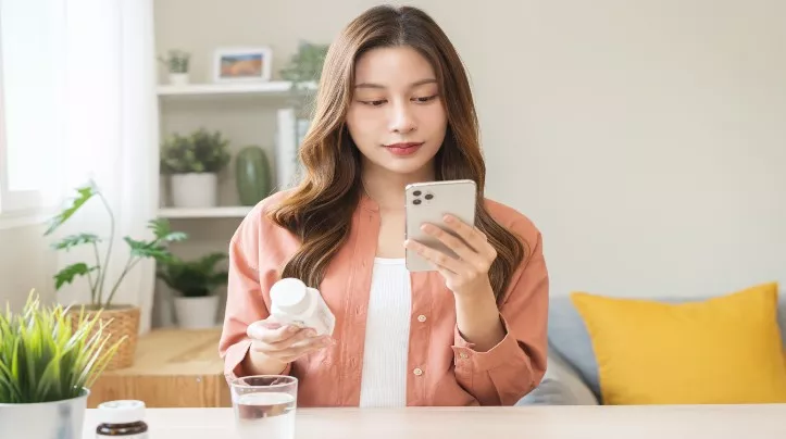 woman taking medicine