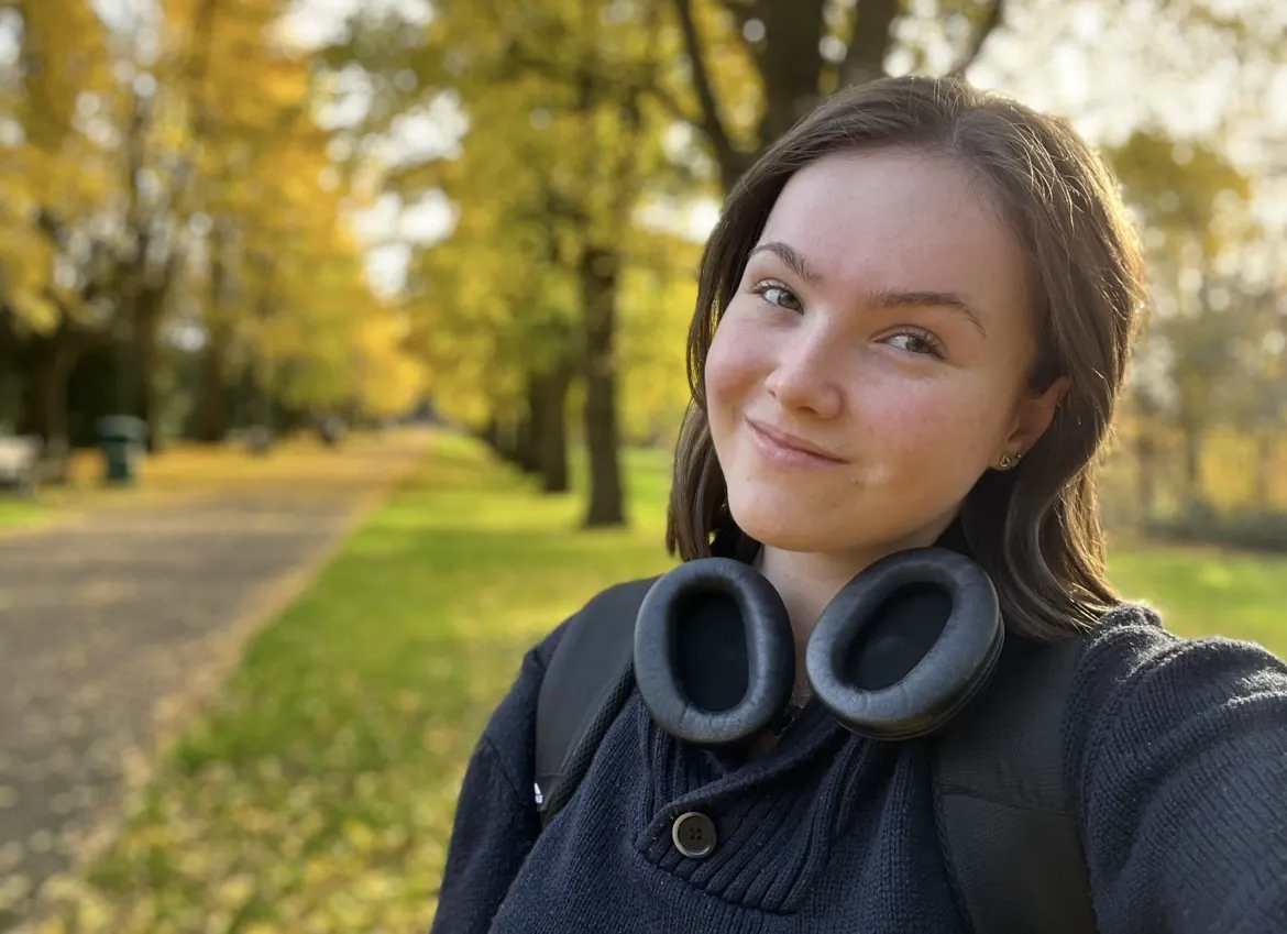 Mya standing outside for a photograph