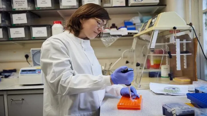 Researcher using tools in the lab