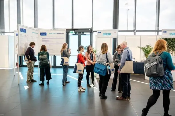 People walking at a busy conference 