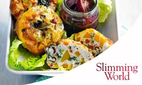 Mini crustless quiches with butternut squash, baby spinach, red pepper, and spring onions on lettuce with a jar of pickled baby beetroot on the side.