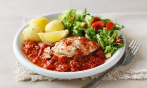 Cod Portugaise with boiled new potatoes and side salad Cod Portugaise with boiled new potatoes and side salad