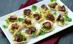 Spicy duck topped poppadoms Spicy duck topped poppadoms