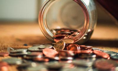 coins spilling out of a jar