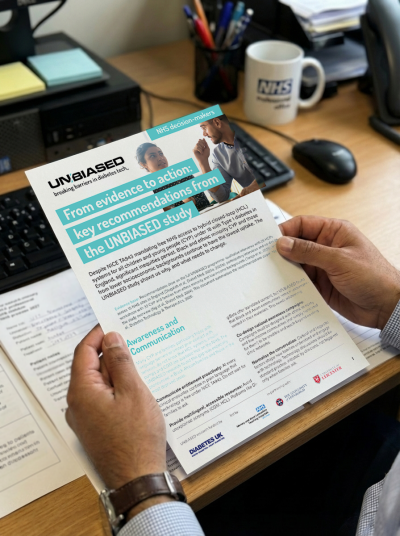 Hands holding documents showing the study's recommendations